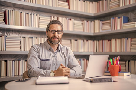 digital classroom. Online education of teacher in classroom. teacher man offer education online. online school education. teacher at lesson during estudy. Digital curriculumの写真素材