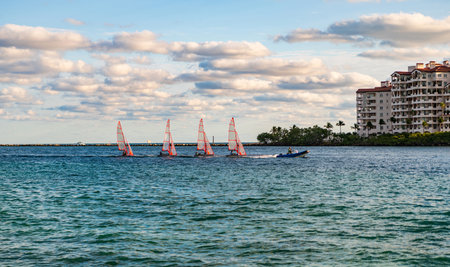 Sea vacation on summer. Fisher island building. Sailing boat yacht. Yachting in Miami, Florida....