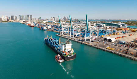 Miami, Florida, USA - March 20, 2025: Freight container on cargo vessel. Cargo ship vessel. Miami port. Container ship. Cargo ship with container in Miami. Commercial vesselの写真素材