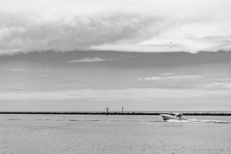 Yacht starts its sea trip. Seascape view of luxury yacht in sea. Luxury yacht in Miami. Summer vacation. Motor yacht boat in sea. Boat trip. Travel destination. Boat in the sea. Copy spaceの写真素材