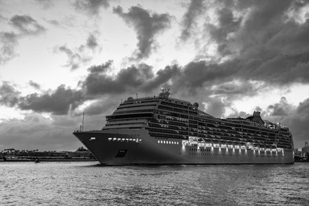 Cruise ship vacation. Majestic cruise ship in vacation summer. Cruise ship vacation. Travel at sea. View of illuminated luxury liner. Ship at night port. Luxury sea vacation. Relaxation and adventureの写真素材