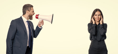 businessman shouting on employee in loudspeaker isolated on white. business man has conflict with partner about promotion. businessman solving conflict. business conflictの写真素材