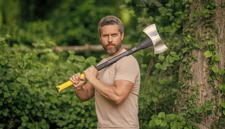Lumberjack axe. Man with logging axe. Hardworking man. Lumberjack hardworking outdoor. Lumberjack....