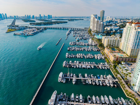 Marina Bay filled with vessels and yacht in Miami. Summer vacation scene with yachts by the oceanfront. Skyline with yachts in Miami. Florida coastline from above with boats. Boat trip in the Miami.の写真素材