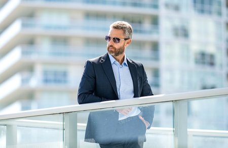 Successful business. Success entrepreneur leadership. Office manager at business break. Successful businessman outdoor. Professional business man wear suit. Business boss man. Ambition at workの写真素材