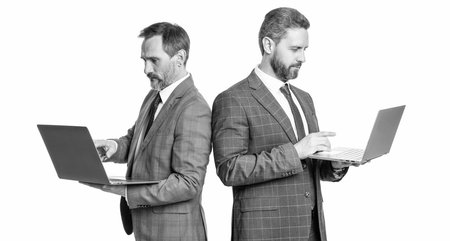 freelancing entrepreneur. video call. business meeting and video conference. two businessmen working online on laptop isolated on white. businessmen develop agile business. Remote interviewの写真素材