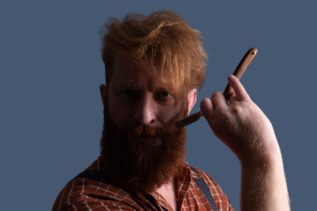Handsome hairstylist with haircut. Barbershop. Man hairdressing and barbering. Hairdresser at...