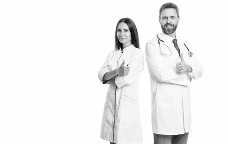 medicine and healthcare. doctor giving thumb up. medical service. nurse and doctor in medicine hospital. healthcare physician doctor isolated on white. copy space bannerの写真素材