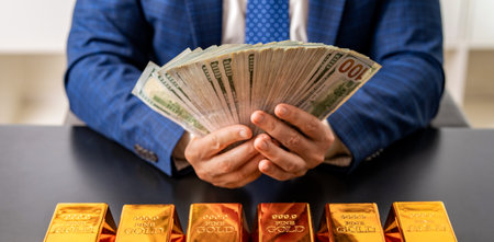 Golden bar. Golden bar vs dollar money. Rich businessman saving gold and cash money. Financial saving success. Successful rich man gold and money. Business success man with gold bar. Saving accountの写真素材