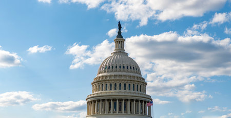 Famous Capitol in Washington DC. Washington DC landmark. Senate and House in Washington DC. Capitol dome. Historic Capitol by the national flag. Capitol dome as symbol of lawの写真素材