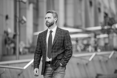 Man lawyer. Businessman walking in city. Businessman in suit. Confident businessman outdoor. Business CEO. Man of success. Successful business. Successful man American street. Collaborative managerの写真素材