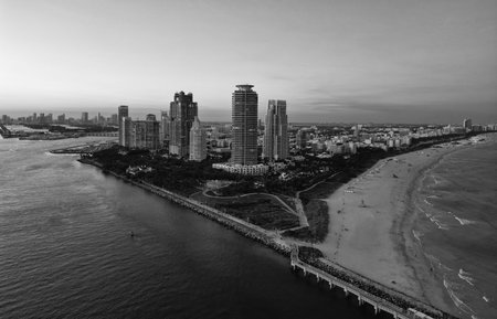 Night city aerial view. Luxury skyscraper in Miami, Florida. City skyline in evening sunset. Aerial cityscape. Miami South beach at night. Evening beauty. Aerial view on skyscraper cityscape at nightの写真素材