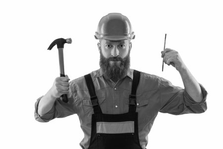 Bearded repairman with hammer. Carpenter repairing with nail isolated on white. Repair man. Man hold...