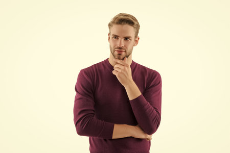 Stylish young man portrait. Casual style of man. Guy has stylish jumper. Young man wearing casual jumper. Casual male style portrait. Millennial portrait. Young man isolated on white. Youth lifestyleの写真素材