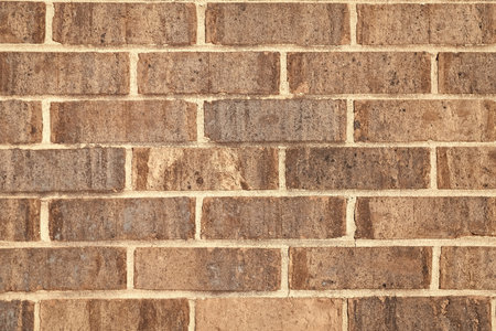 Brick masonry background. Building material concept. Surface of brickwall. Textured brown backdrop....