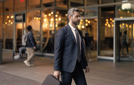 Businessman outdoor. Businessman in suit. Mature Hispanic businessman. Business boss portrait of business man. Successful business. Success of entrepreneur. Office manager. Walking to officeの写真素材