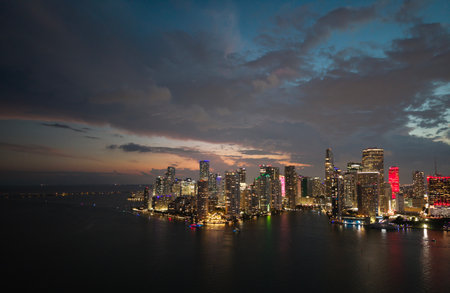Famous landmarks of Miami Brickell from above at night. Drone view of the Brickell in Miami city. Business in Brickell district. Biscayne Bay Florida iconic urban coastline in daylight.の写真素材