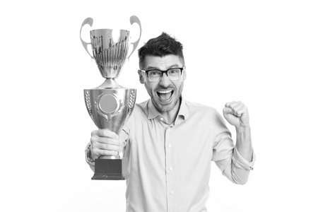 Business champion success. Business success. Businessman celebrate victory on business negotiation isolated on white. Successful businessman man holding champion cup. Best entrepreneurの写真素材