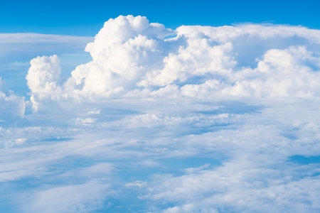 blue sky with a few clouds. The sky is very bright and the clouds are scattered throughout....