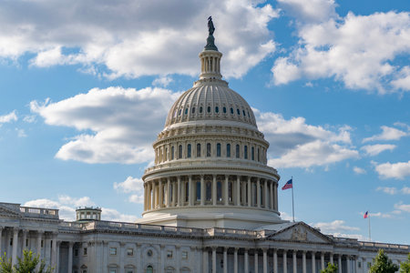 Capitol dome. Historic Capitol by the national flag. Capitol dome as symbol of law. Washington monument architecture. Washington DC. US Senate. Federal government in the nation capital. USA symbolの写真素材