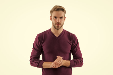 Young man isolated on white. Stylish young man portrait. Casual style of man. Guy has stylish jumper. Young man wearing casual jumper. Casual male style portrait. Millennial portraitの写真素材