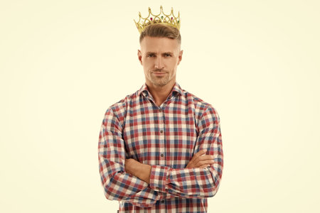 Man in checkered shirt and crown. Ambitious man having success with crown. Business success and...