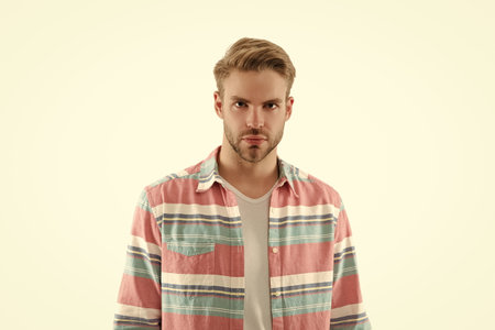 Young man isolated on white. Stylish young man portrait. Casual style of man. Guy has stylish haircut. Young man wearing casual shirt. Casual male style portrait. Millennial portraitの写真素材