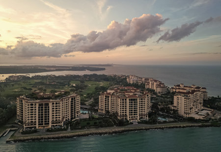 Fisher island sunset view. Sunset aerial view of Fisher island, Miami. Miami beach with waterfront architecture. Miami residential building, Florida. Fisher island. Travel destinationの写真素材