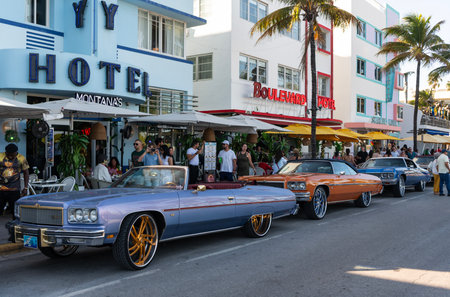 Miami, Florida, USA - April 07, 2025: Car Chevrolet Caprice parked outdoor. Golden Chevy, side view. Chevrolet Caprice retro convertible muscle car. Convertible retro car Chevrolet Capriceのeditorial素材