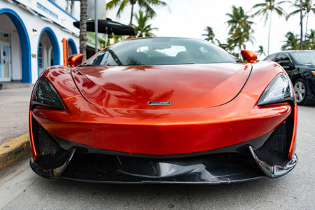 Miami, Florida, USA - July 06, 2025: 2017 McLaren 570S sport car coupe. Luxury orange sportscar McLaren 570S. Car of McLaren 570S parked outdoor, front viewのeditorial素材