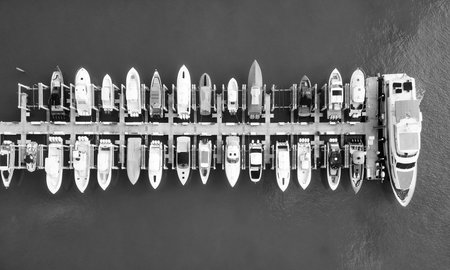 Marina with luxury sea boat. Yacht club and marina in Miami. Luxury marina with private yacht boat. Docked yacht boat in harbor. Luxury summer vacation in Miami. Private boat top. Marina facilitiesの写真素材