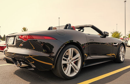 Chicago, Illinois, USA - September 08, 2024: Jaguar F-TYPE S v8 AWD Convertible vehicle, front view. Modern Jaguar F-TYPE S v8 AWD Convertible car black color. F-TYPE R75 AWD Convertible car. F-TYPE S v8 AWD Convertible at Chicagoのeditorial素材