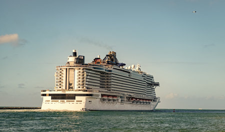 Majestic view of cruise in summer vacation. Cruise ship tour and travel at sea. Trip on luxury liner voyage. Ship leaving Miami beach port. Miami tour. Cruise ship voyage. Passenger huge shipの写真素材
