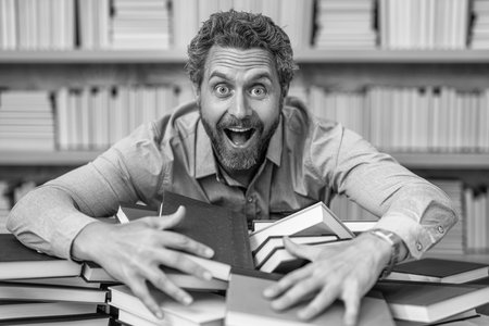 prepare for school exam. busy overworked millennial student read book. overworked man student reading book in a bookstore or school library. literature teacher in school with bookの写真素材