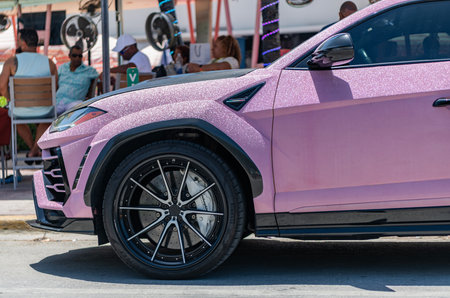 Miami, Florida, USA - July 26, 2025: Lamborghini Urus luxury SUV with sparkling glowing glitter...