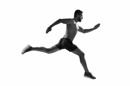 Runner at long sport run. Sportsman runner running isolated on white. Sport run. Muscular man...