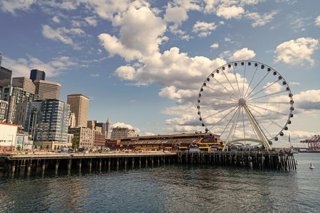 Seattle, Washington, USA, July 26, 2024: Amusement park with Ferris wheel. Observation Ferris wheel. Fairground ride on observation wheel. Entertainment sightseeing. Copy space. Ferris wheelのeditorial素材