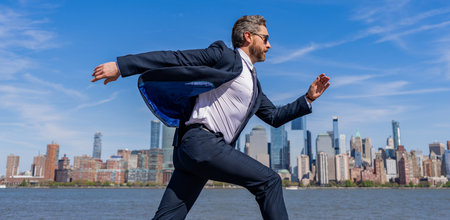 Business success in big city. Businessman running to success. Successful deal. Business success. Successful businessman hurrying on New York city. Business man in Manhattan. Corporate run downtownの写真素材