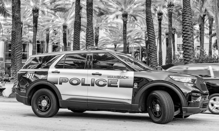 Miami, Florida, USA - November 18, 2024: Police car outside. Emergency 911 service. Emergency vehicle of police 911. Police car Ford Interceptor in Miami, side view. Ford Interceptorのeditorial素材