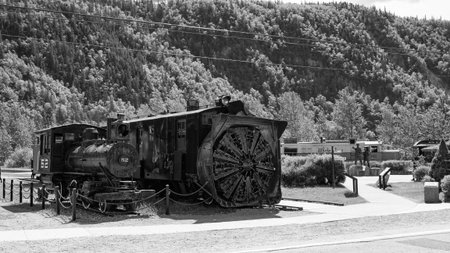 Skagway, Alaska, USA - July 07, 2019: White Pass Yukon Railway train. Railway or railroad. Train railway station. Yukon ride landscape in Skagway. Scenic White Pass Yukon Railroad locomotiveのeditorial素材