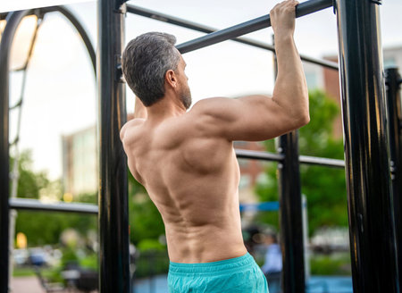 Muscular man sportsman with strong back muscle. Sport pullup workout. Sport training. Man sportsman...