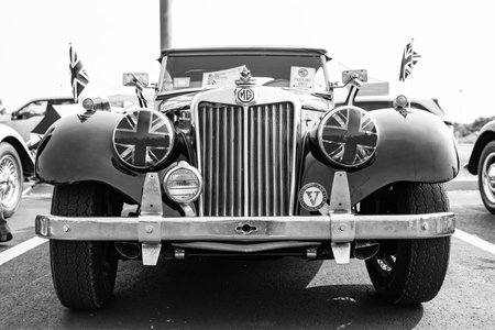 Chicago, Illinois, USA - September 08, 2024: MG TF sportscar retro convertible vehicle, front view....