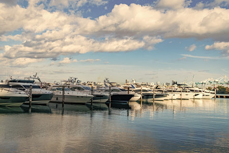 Docked charter yacht. Yachting marina. Luxury yacht charter. Miami port marina. Luxury yachting in summer. Docked yacht in Miami beach. Marina luxury cityscape. Luxurious lifestyleの写真素材