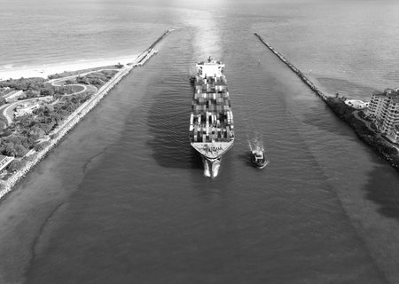 Cargo ship vessel leaving port. Container ship. Export and import. Cargo business. Port of Miami....