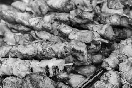 Grilled poultry kebab. Delicious shish kebab. Grilled BBQ. Skewer meat cooking on barbecue,...