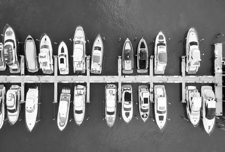 Yacht club and marina in Miami. Luxury marina with private yacht and boat. Docked yacht boat in harbor. Luxury summer vacation in Miami. Private boat top view. Marina with luxury sea boatの写真素材