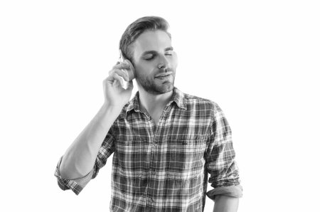 Man listening audio in music headphones. Caucasian man isolated on white. Student guy listen audio....