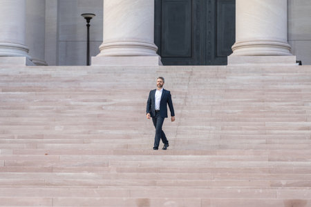 Business entrepreneur success. Businessman walking outdoor. Successful businessman leader. Ambitious businessman in suit. Business boss man walk on stairs. Successful business and leadershipの写真素材