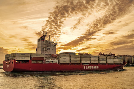 Miami, Florida, USA - January 03, 2025: Freight container loaded on cargo vessel. Drone view cargo ship entering port. Container ship. Cargo ship Seaboard Genesis with container in Miamiのeditorial素材