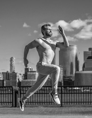 Man sportsman running for exercise with naked torso. Sportsman jogger running. Morning sport workout...